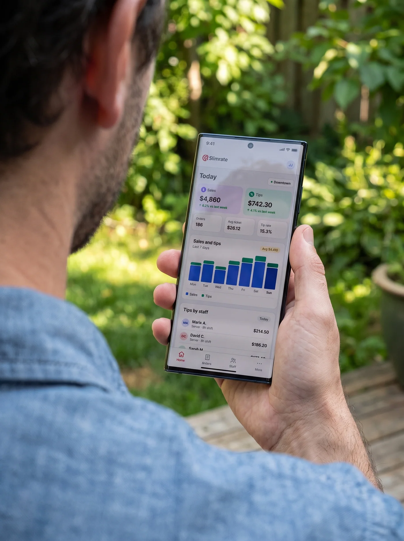 Business owner checking today's sales in the Slimrate Business app on a phone