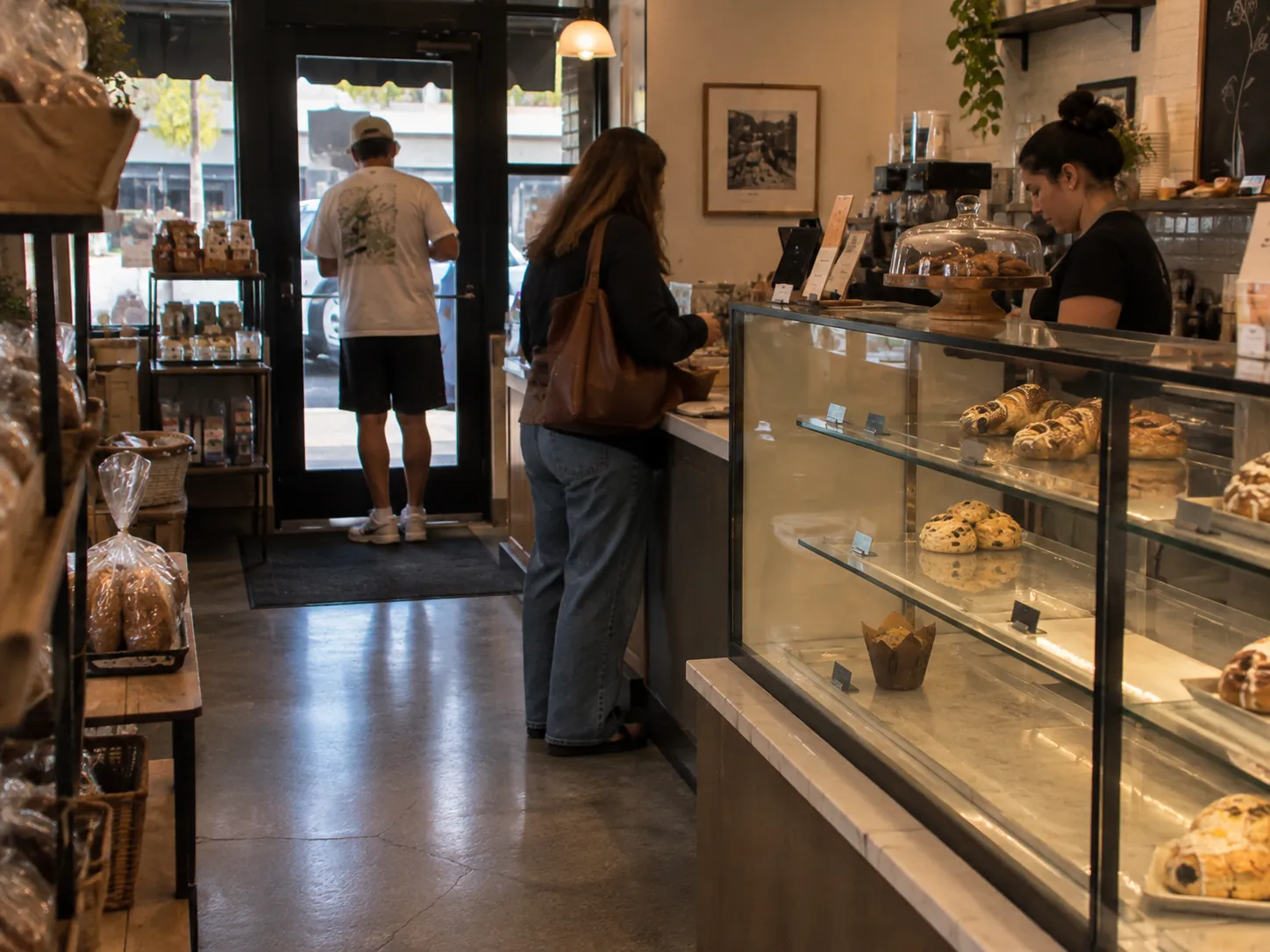 Bakery interior with customers at the pastry counter