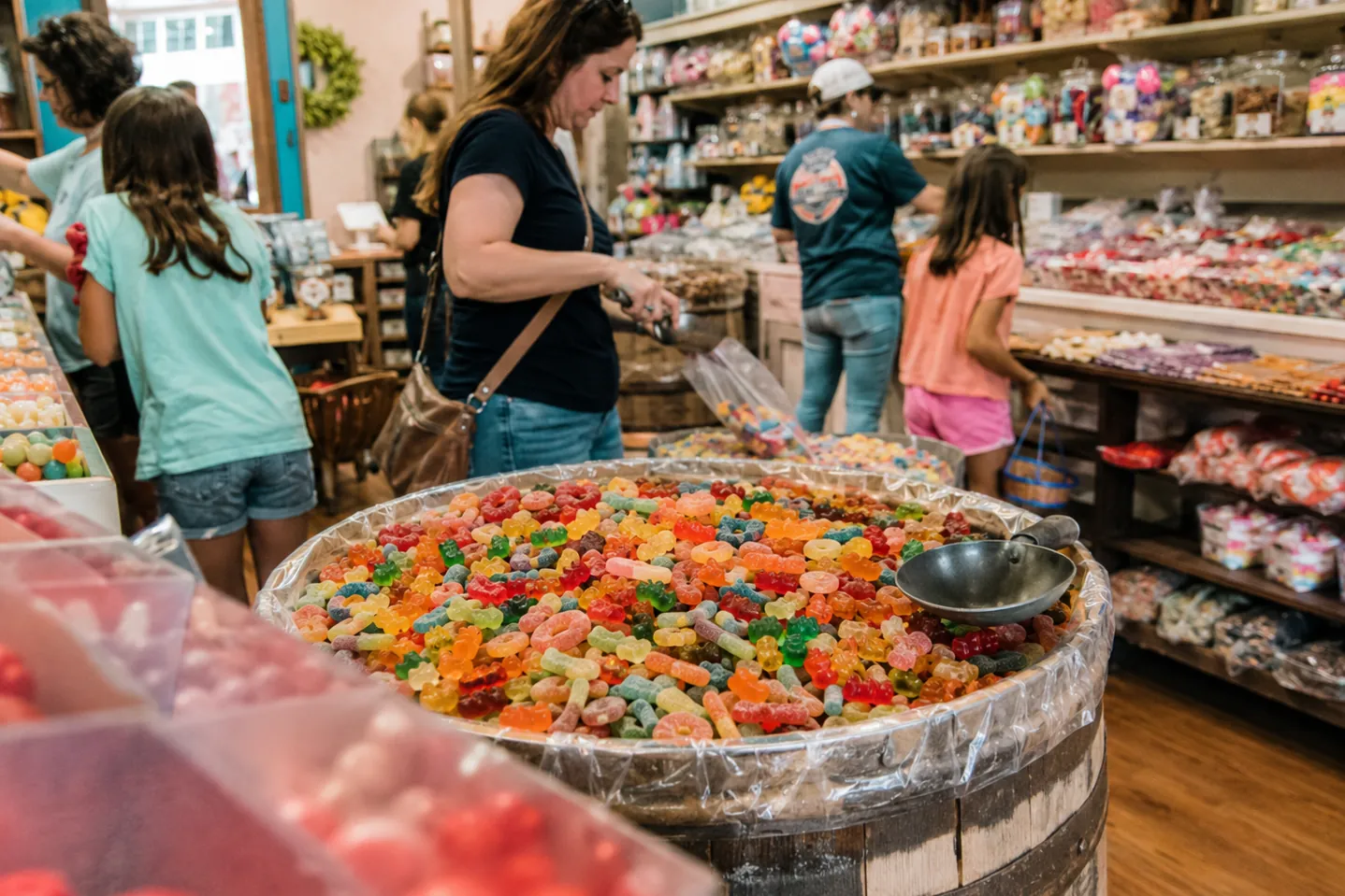 Candy store with bulk bins and shelves of packaged sweets